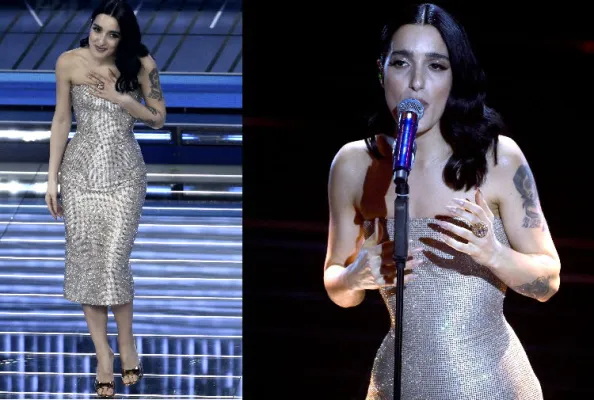 Levante: sceglie un abito luminoso, essenziale e ultra femminile, giocato tutto sulla silhouette e sulla luce. È un look che parla sottovoce ma arriva lontano, perché accompagna la sua performance senza distrarla. Ilaria Gaudenti Al Pacino